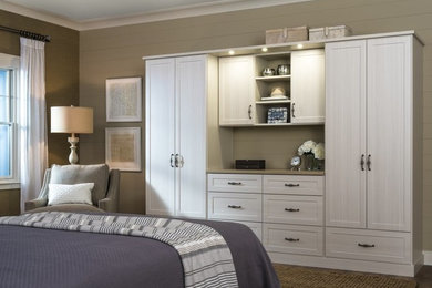 Inspiration for a mid-sized transitional master bedroom in Other with beige walls and dark hardwood floors.