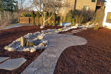 Patio, Walkway, and Creek Bed on Sloped Property in Bellingham