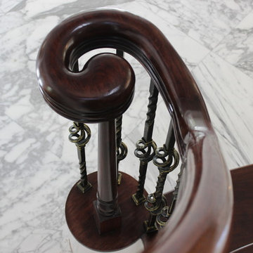 Walnut Circular Stair with Twist & Basket Iron Balusters