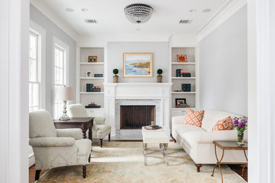 Huge transitional formal and enclosed medium tone wood floor and brown floor living room photo in Houston with a standard fireplace, a stone fireplace, gray walls and no tv