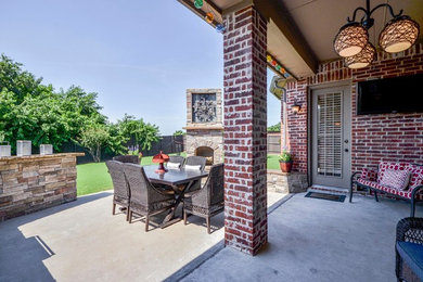 Design ideas for a mid-sized transitional backyard patio in Dallas with concrete slab and no cover.