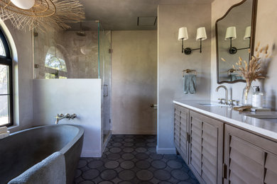 Bathroom - mid-sized mediterranean master beige tile concrete floor, gray floor and double-sink bathroom idea in San Francisco with louvered cabinets, brown cabinets, a one-piece toilet, beige walls, a drop-in sink, quartz countertops, a hinged shower door, white countertops and a built-in vanity