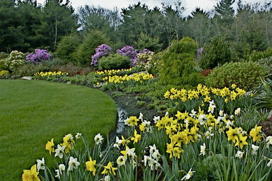 Photo of a mid-sized traditional full sun backyard landscaping in Boston for spring.
