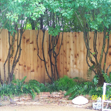 Cedar Fence on Stone Retaining Wall