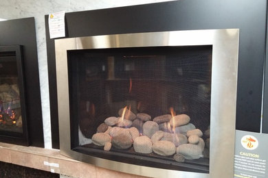 Inspiration for a mid-sized timeless living room remodel with a standard fireplace