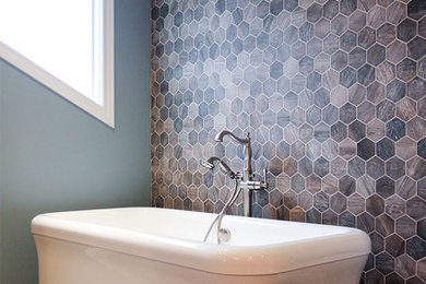 Example of a mid-sized transitional master brown tile and porcelain tile brown floor bathroom design in Chicago with dark wood cabinets, blue walls and granite countertops