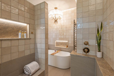 Inspiration for a large modern master beige tile and ceramic tile porcelain tile, beige floor and tray ceiling bathroom remodel in Austin with beige walls