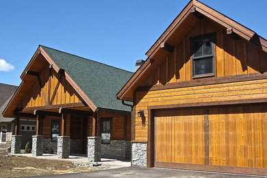Mid-sized arts and crafts brown one-story wood exterior home photo in Boise