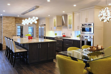 Open concept kitchen - large contemporary l-shaped dark wood floor and brown floor open concept kitchen idea in Ottawa with an undermount sink, glass-front cabinets, dark wood cabinets, quartz countertops, stainless steel appliances and an island