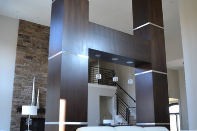 Trendy living room photo in Omaha with a stone fireplace and white walls