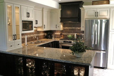 Example of a small transitional u-shaped ceramic tile eat-in kitchen design in Vancouver with a double-bowl sink, beaded inset cabinets, granite countertops, brown backsplash, stainless steel appliances and a peninsula