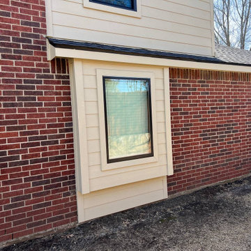 Primed James Hardie Siding in Universal Khaki.