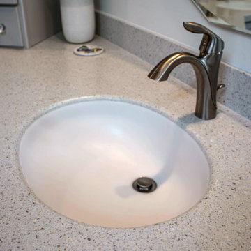 Waypoint Gray Shaker Door Cabinetry with Tiled Shower and Matching Tub Surround