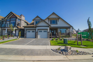 Example of a large trendy multicolored three-story concrete fiberboard exterior home design in Vancouver