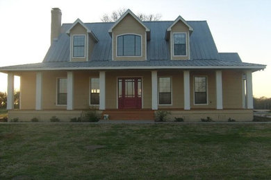 Beige two-story wood exterior home photo in Dallas