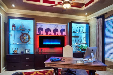 Mid-sized transitional freestanding desk carpeted home office photo in Oklahoma City with beige walls and a metal fireplace