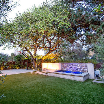 Exterior spa, firepit, sports court of custom home in Cheviot Hills, CA