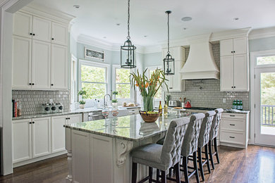 Mid-sized french country l-shaped medium tone wood floor and brown floor eat-in kitchen photo in Nashville with a farmhouse sink, beaded inset cabinets, white cabinets, quartzite countertops, gray backsplash, mosaic tile backsplash, stainless steel appliances, an island and gray countertops