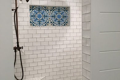 Small trendy black and white tile and ceramic tile ceramic tile and white floor drop-in bathtub photo in Other