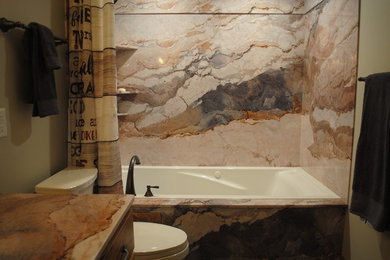 Bathroom - small rustic multicolored tile and stone slab ceramic tile and brown floor bathroom idea in Other with recessed-panel cabinets, light wood cabinets, a two-piece toilet, beige walls and an undermount sink