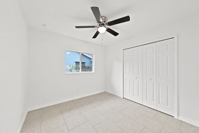 Bedroom - contemporary guest porcelain tile bedroom idea in Miami