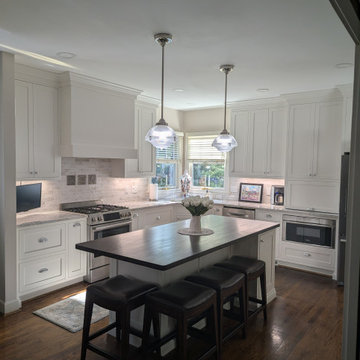 White inset cabinetry with walnut custom accents