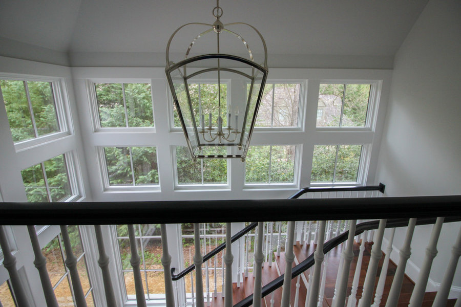 Powerful Impression by Floating Staircase in Suburban Foyer