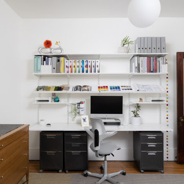 Eclectic White Home Office with Modular Wall Storage