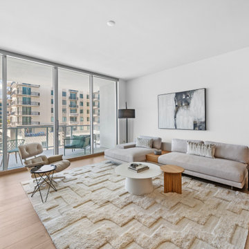 Open-Concept Living Room With City Views — Bayso Sarasota Condo