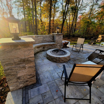 Landscaping and Patio in Niskayuna with firepit and deck. Includes sitting walls