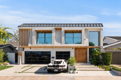 Trendy white two-story exterior home photo in Orange County