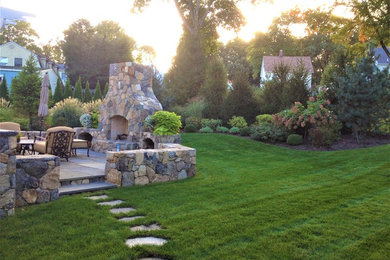 Patio - mid-sized rustic backyard stone patio idea in New York with a pergola