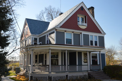 Design ideas for a traditional grey exterior in Cleveland with mixed siding and a gable roof.