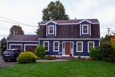 Inspiration for a blue shingle house exterior remodel in Bridgeport with a shingle roof and a black roof