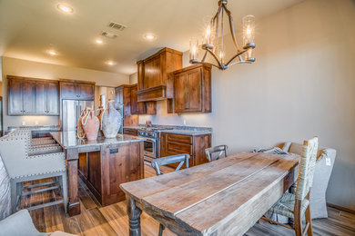 Kitchen/dining room combo - mid-sized transitional light wood floor kitchen/dining room combo idea in Austin with beige walls