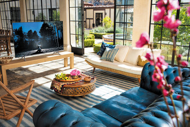 Inspiration for a mid-sized transitional open concept ceramic tile and brown floor living room remodel in Other with beige walls, no fireplace and a tv stand