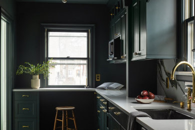 Example of a mid-sized classic galley ceramic tile and gray floor eat-in kitchen design in Minneapolis with an undermount sink, shaker cabinets, green cabinets, quartz countertops, multicolored backsplash, ceramic backsplash, stainless steel appliances and white countertops