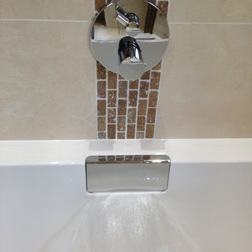 Wetroom: Porcelain & ceramic travertine effect.