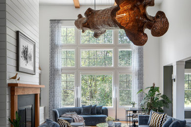 Living room - huge open concept medium tone wood floor, brown floor, coffered ceiling and shiplap wall living room idea in Columbus with white walls, a standard fireplace, a tile fireplace and no tv