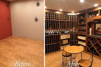 Inspiration for a mid-sized timeless wine cellar remodel in Portland Maine with storage racks