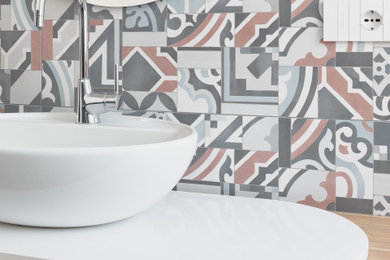 Inspiration for a small modern powder room in Other with multi-coloured tile, mosaic tile and a floating vanity.