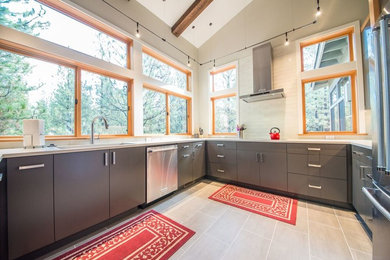 Inspiration for a mid-sized contemporary u-shaped porcelain tile enclosed kitchen remodel in Orange County with an undermount sink, flat-panel cabinets, gray cabinets, quartz countertops, white backsplash, glass tile backsplash, stainless steel appliances and no island