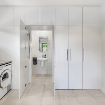 Sleek and Timeless Laundry and Bathroom Cabinetry