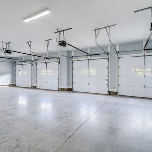 Huge transitional attached four-car garage photo in New York