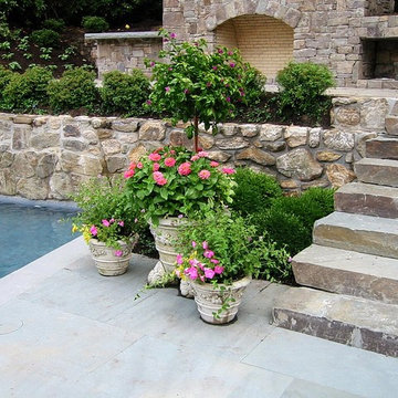 Pool Stone Hearth and Surrounding Gardens