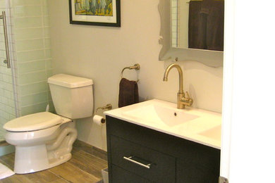 Mid-sized eclectic master gray tile and ceramic tile ceramic tile bathroom photo in Chicago with furniture-like cabinets, dark wood cabinets and gray walls