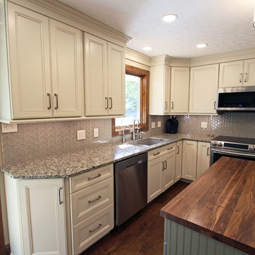 Cream Kitchen with Green Island with Butcher Block Countertop