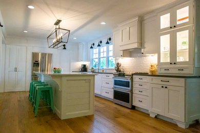 Example of a large eclectic kitchen design in St Louis with quartzite countertops and white countertops