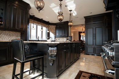 Example of a huge classic kitchen design in Ottawa with raised-panel cabinets, dark wood cabinets, quartz countertops, beige backsplash, porcelain backsplash, paneled appliances and an island