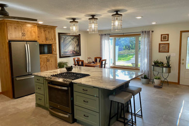 Example of a large classic l-shaped ceramic tile and gray floor eat-in kitchen design in Minneapolis with an undermount sink, flat-panel cabinets, medium tone wood cabinets, quartz countertops, white backsplash, stone tile backsplash, stainless steel appliances, an island and white countertops